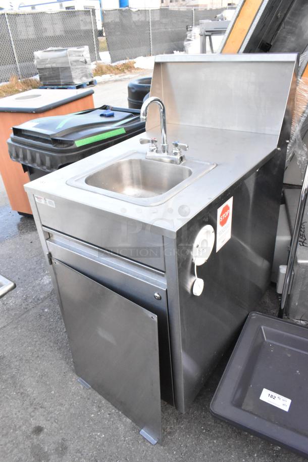 QualServ stainless steel single bay portable sink, commercial casters, faucet, storage, used condition, visible tags.