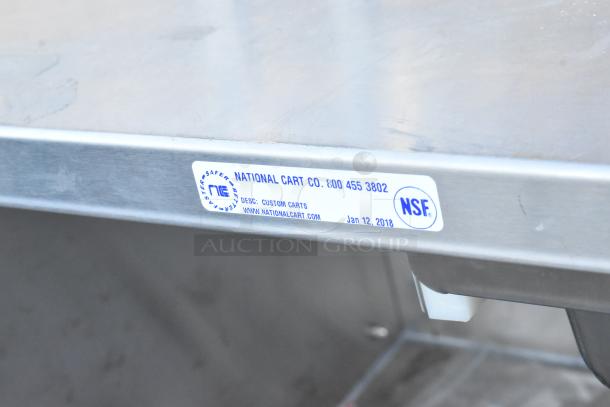 National Cart Co stainless steel table with under shelf, drawer, and commercial casters. NSF certified. Custom carts label visible.