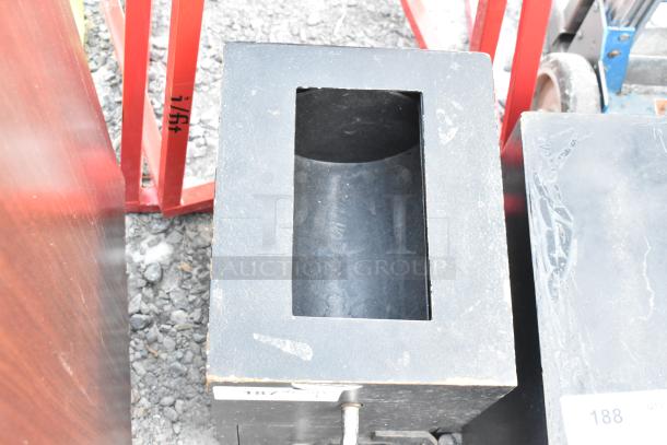 Black metal single compartment safe, no combination, visible wear, sturdy design, ideal for secure storage.