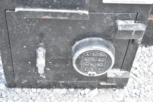 Black metal safe by Corporate Safe Specialists, single compartment, lacks combination, visible keypad. Used condition.