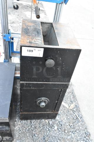 Black metal single compartment safe, worn condition, features combination lock but no combination included, auction tag 189.