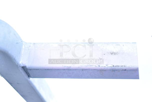 "Commercial Pan Transport Rack, sturdy, on heavy-duty casters. Visible text: 'Winco ALRK-20BK'. Used condition."