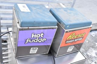 Karma 104 countertop chocolate warmer, 120 volts, dual units, labeled "Hot Fudge" and "Reese's," signs of wear.