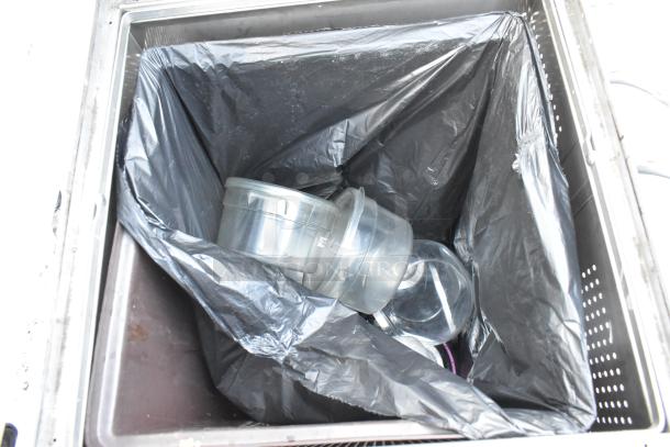 United Receptacle stainless steel trash can shell with black liner. Includes removable plastic bins. Good condition.