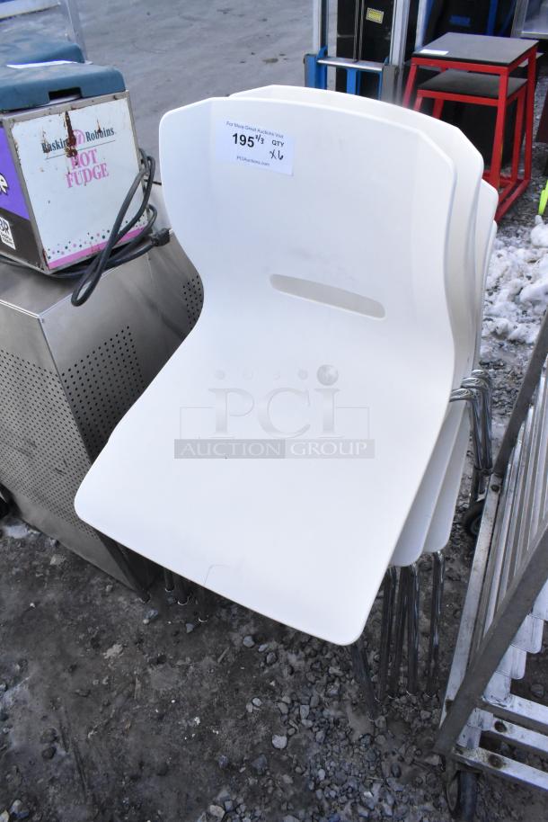 6 white poly chairs with chrome legs, stackable, good condition. Auction lot tag: quantity x6, item 195.