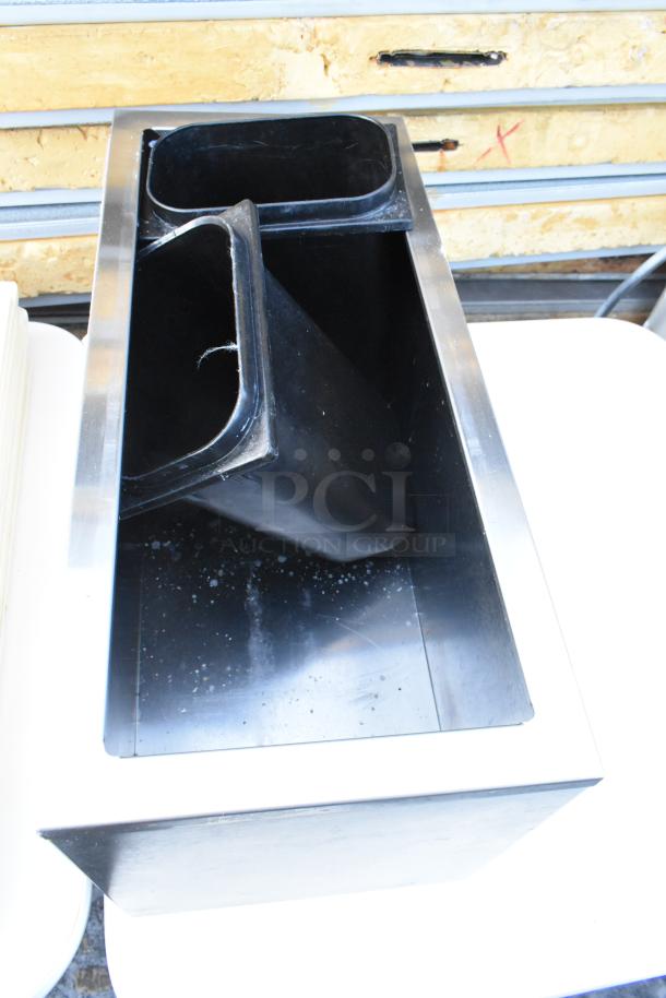 White dining table with black metal baking pans and white poly lids, showing minimal wear. Includes three tables per bid.