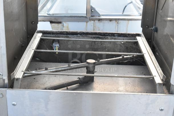 Knight GT Series Commercial Dishwasher, straight pass-through type. Visible wear, interior view with spray arms and wires.