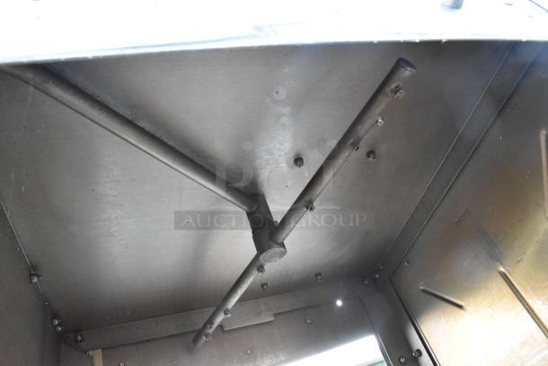 Knight GT Series Commercial Straight Pass Through Dishwasher interior view, showing stainless steel construction and spray arms.