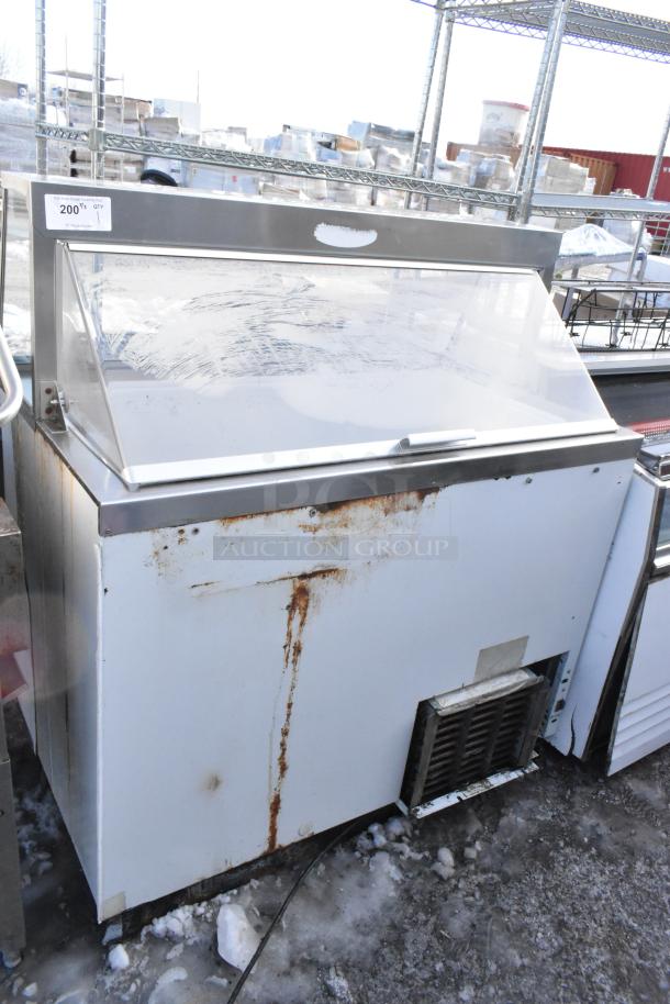 Commercial floor style ice cream dipping cabinet, 115 volts, 1 phase. Visible wear and rust on exterior.
