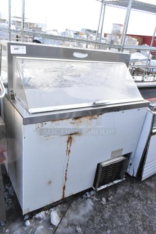 Commercial floor style ice cream dipping cabinet, 115 volts, 1 phase. Visible wear and rust on exterior.