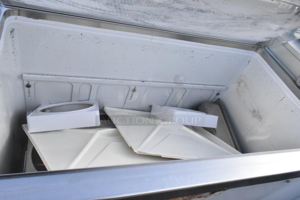 Commercial floor-style ice cream dipping cabinet, 115 volts, 1 phase, interior view showing dividers and slight wear.