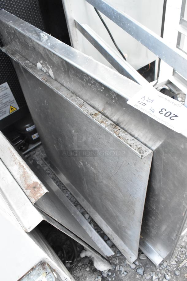 Four metal panels with a label indicating lot number 203. Panels show signs of wear and surface scratches.