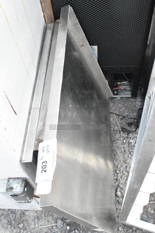 Four metal panels stacked, showing a reflective surface with slight wear. Auction tag "203" visible, indicating quantity "4X".