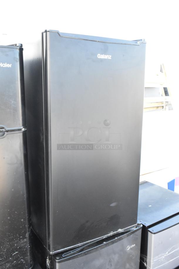 Five mini coolers including Haier HC32TW10SB, Black & Decker BCE46B, Galanz GLR33MBKE23, and Mainstays DG40BY1A, 120V, visible in varying conditions.