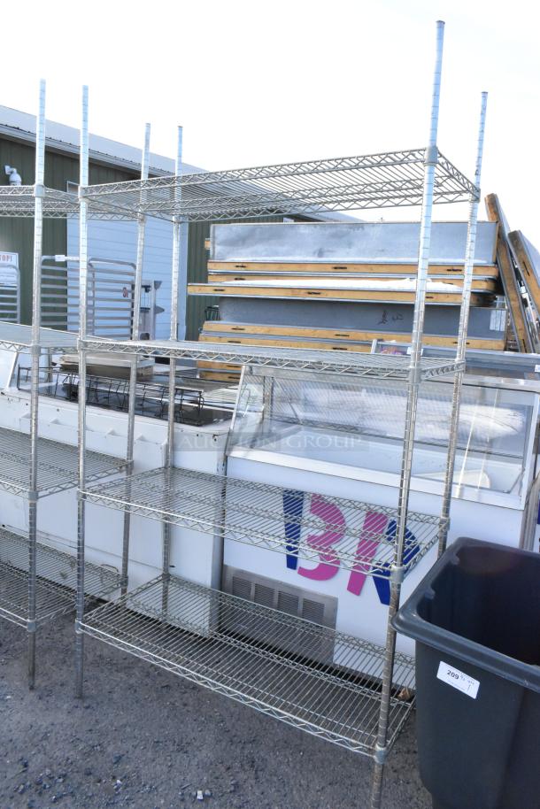 Chrome finish 4-tier wire shelving unit, sturdy design, ideal for storage. Buyer must dismantle for transport.