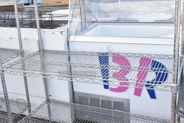 Chrome finish 4-tier wire shelving unit, sturdy, excellent condition. Buyer must dismantle. Freight charges apply.