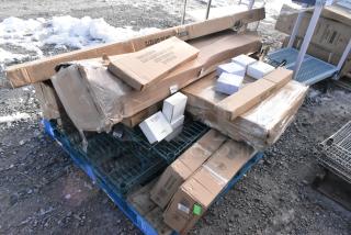 A pallet with 10 brand new scratch and dent items, including cigarette receptacle and legs, boxes unopened, some wear on packaging.