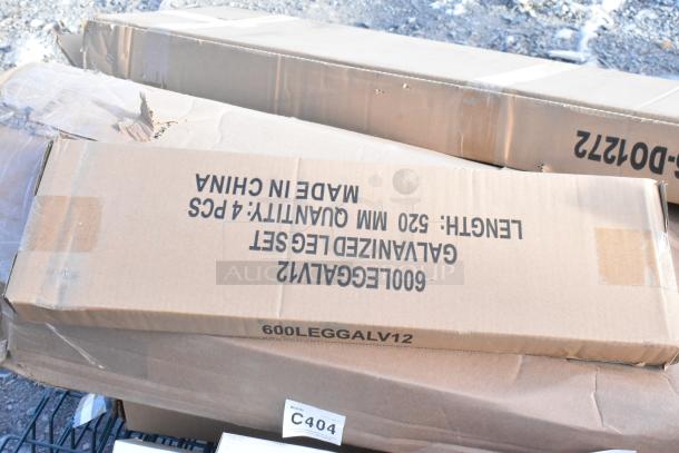 Cardboard boxes labeled "Galvanized Leg Set, 520mm, 4 pcs, Made in China" on the ground, indicating contents and origin.