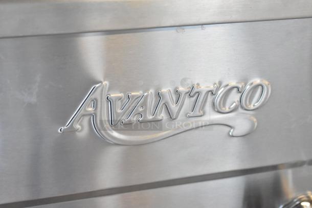 Avantco 177F202 fryer, stainless steel surface with embossed logo, new condition, dual tank, includes lids and baskets.