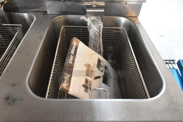 Brand new Avantco 177F202 30 lb. dual tank electric countertop fryer with user manual in basket, includes 2 lids and baskets.