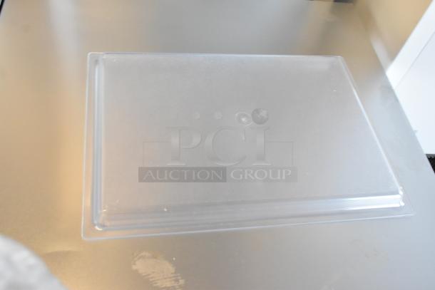 Brand new Cal-Mil 325-13-12 13" x 18" clear bakery tray with scratch and dent. Set of 4 trays, shallow design.