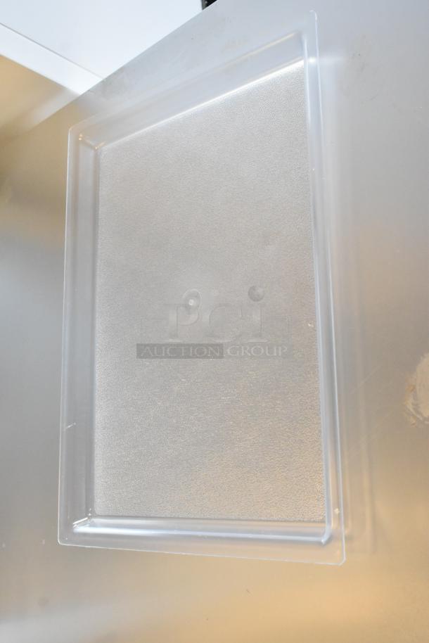 Cal-Mil 325-13-12, 13" x 18" clear bakery tray, brand new with minor scratch and dent. Shallow design, durable material. Set of four.