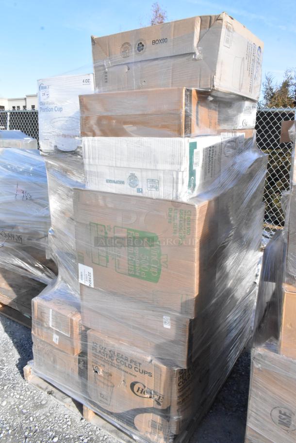 Pallet of 33 scratch and dent items, including boxes of popcorn bags, containers, toilet paper, and can liners, wrapped in plastic.