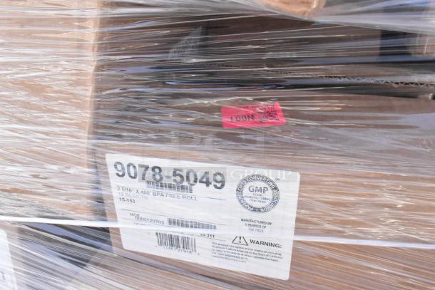 Plastic-wrapped pallet of scratch and dent items. Visible labels show "9078-5049" and "BPA Free Roll." Includes wall heater, plates, POS paper.