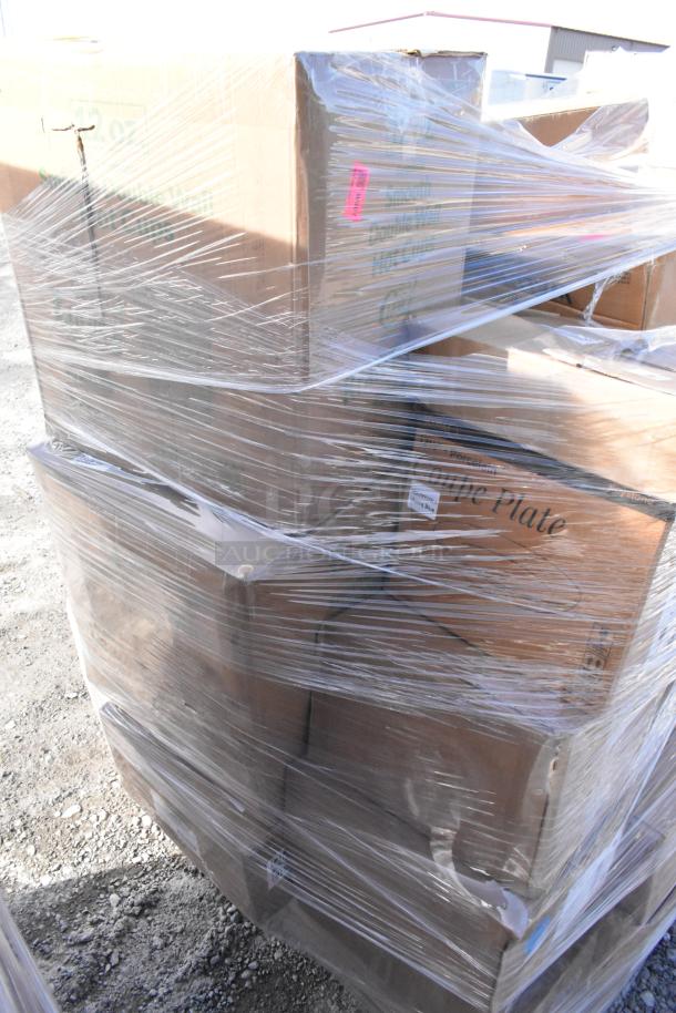 Pallet of 32 brand new scratch and dent items wrapped in plastic, including Boltic wall heater, plates, and POS paper rolls.