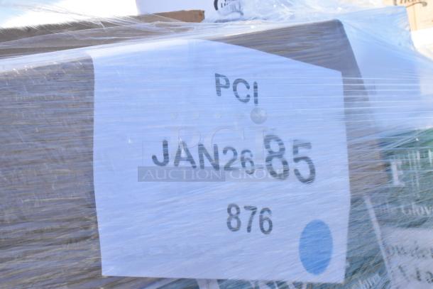 A pallet wrapped in plastic with a label stating "PCI JAN26 85 876." Contains scratch and dent items like containers, gloves, and bags.