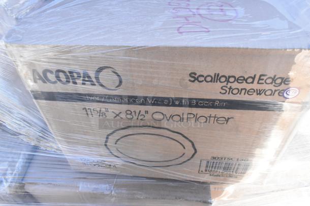 Box of Acopa scalloped edge stoneware platters, 11⅝" x 8½", ivory with black rim. New condition, wrapped in plastic.