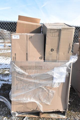 Large pallet of scratch and dent items including napkins, containers, towels, mixing glasses, wrapped in plastic, some boxes labeled.