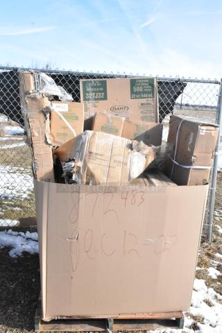 Cardboard box containing assorted new scratch and dent items, including bakery dolly, wire security cage, foam cups. Markings indicate date and item count.
