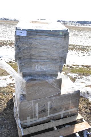 4 new scratch and dent items on pallet, including Regency dish table, Choice storage box, and Detecto scale. Wrapped in plastic.