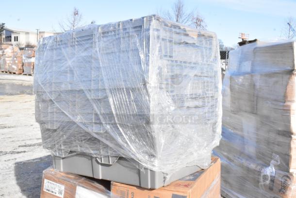Shrink-wrapped pallet containing scratch and dent items, including a Regency dish table, stackable chafer tote, and Cardinal scale.