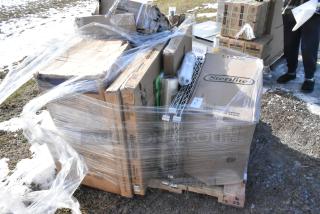 Clear wrapped pallet with boxes labeled "Sterilite" containing brand new scratch and dent items, including a blender station.