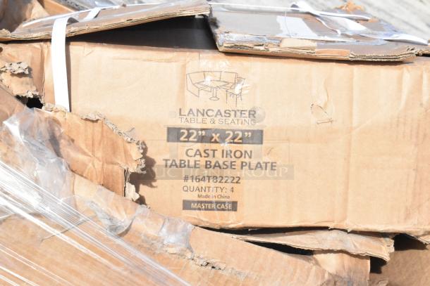 Damaged box labeled "Lancaster Table & Seating" containing 22"x22" cast iron table base plates, quantity of 4.