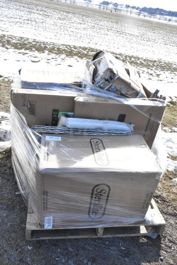 Pallet of 13 new scratch and dent items, including blender station, tumblers, and tabletops. Items wrapped in plastic.