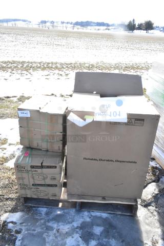 Boxes containing new scratch and dent items including Southbend tray, dome lids, and Pitco filter pan, on a pallet.