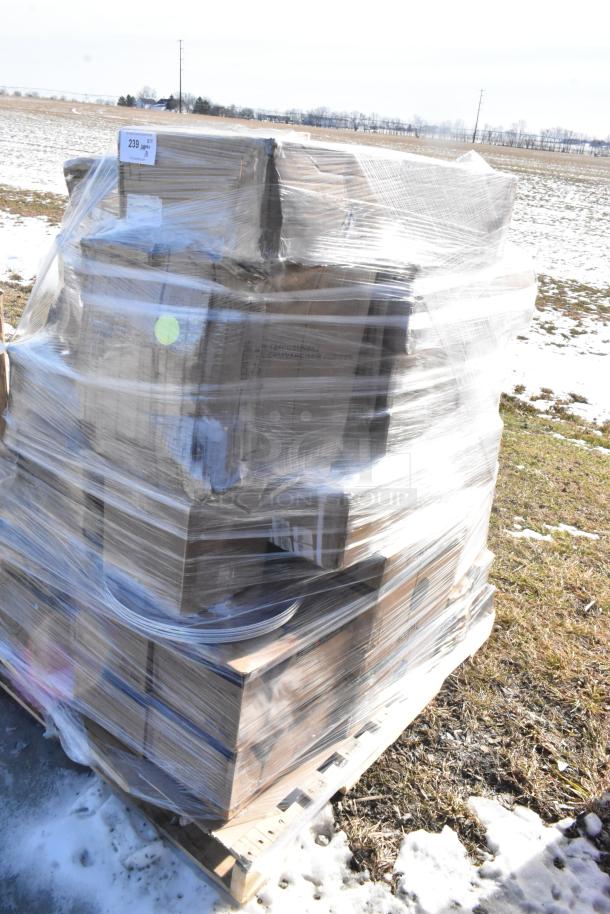 Pallet of 31 new scratch and dent items wrapped in plastic, including wine glasses, pizza pans, and coupe plates.