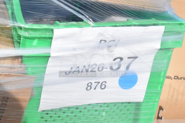 Green crate wrapped in plastic with a label marked "JAN26-37, 876." Contains scratch and dent items like wine glasses and pizza pans.