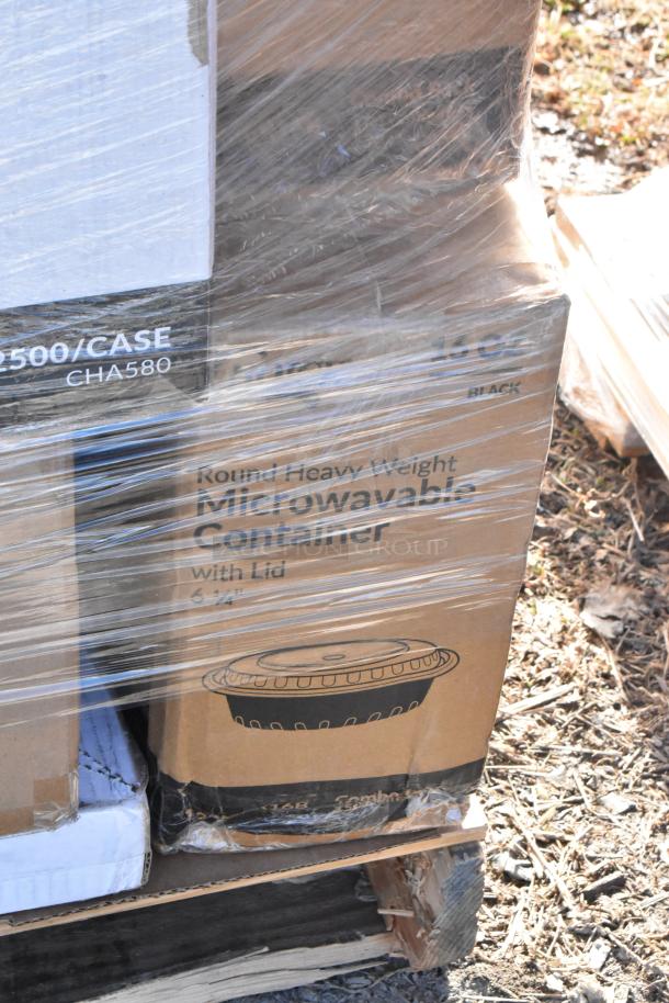 Stack of brand new scratch and dent items, including Choice portion cup lids and microwavable containers, wrapped in plastic.