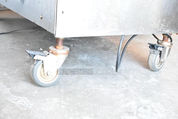 2016 Hobart MG2032 commercial meat mixer grinder on casters, 208V, 3 phase, tested and working, foot pedal visible.