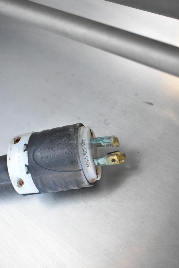 Close-up of a power plug from the 2016 Hobart MG2032 meat mixer grinder, showing 30A, 125/250V markings.