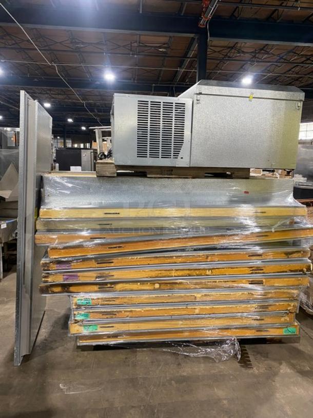 Commercial refrigeration unit with multiple insulated panels, wrapped in plastic, appears in used condition. No visible labels.