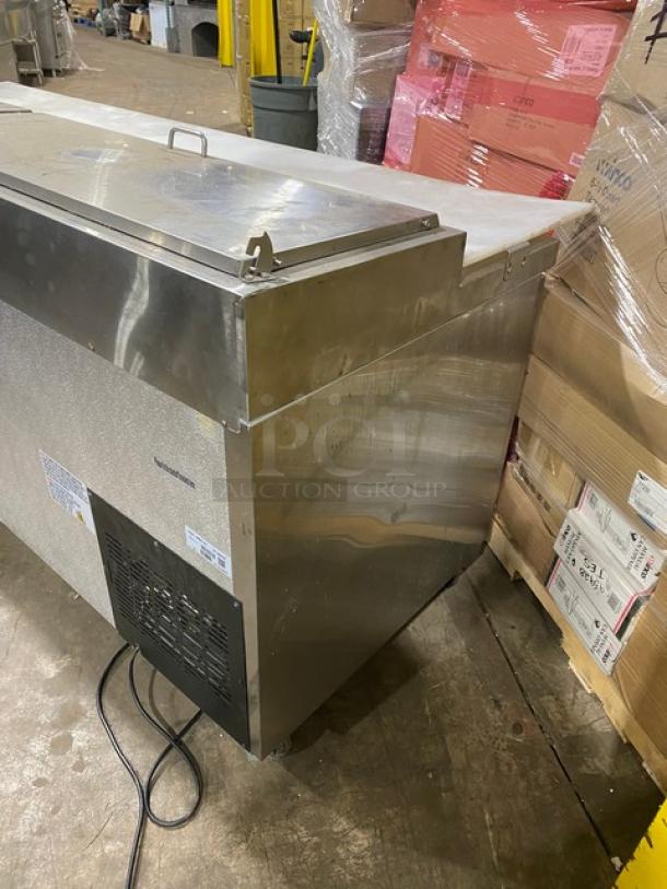Commercial ice machine, stainless steel, used condition, visible power cord, manufacturer label intact, no visible damage.