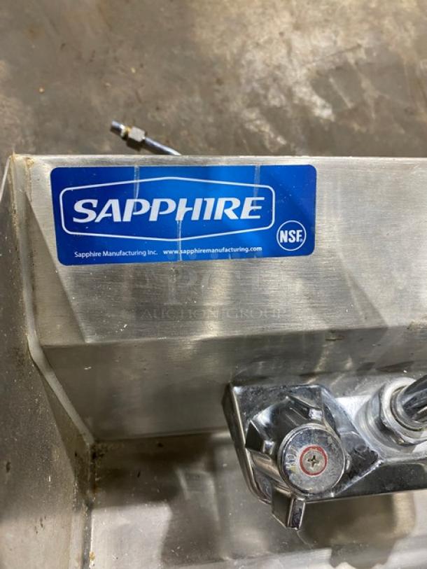 Stainless steel sink by Sapphire Manufacturing, features NSF certification label, durable faucet, excellent condition.