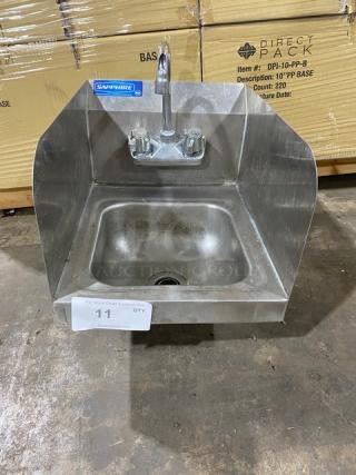 Stainless steel wall-mounted sink with faucet, brand "Sapphire," excellent condition, protective side splashes, suitable for commercial use.