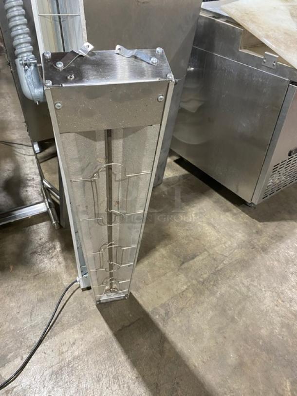 Industrial heating element with metal casing, visible wires, and attached conduit. Good condition. No visible markings.