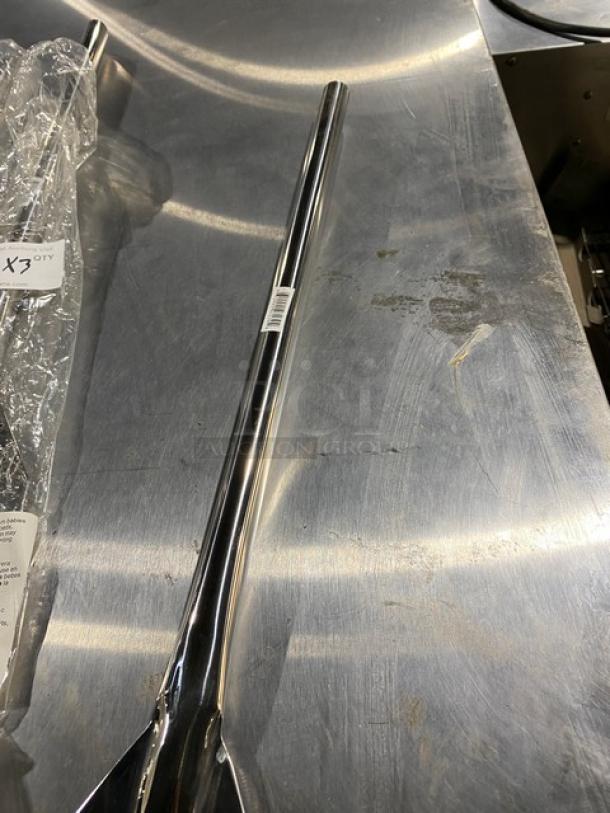 Stainless steel pole with bar code label, sleek and shiny, no visible damage, ideal for industrial or construction use.